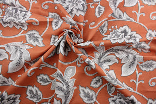  Robert Allen© McGivern in Orange fabric offers a vibrant, multi-purpose floral vine print on an orange background. The gray and white design is highlighted by a soil and stain repellant finish.  It can be used for several different statement projects including window accents (drapery, curtains and swags), toss pillows, headboards, bed skirts, duvet covers, upholstery, and more.