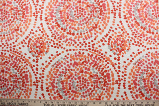  Robert Allen© Glimpse in Orange is a multi-purpose fabric perfect for any home decorating project.  Crafted from a cotton blend, it features a large circular print incorporating shades of orange, coral, gray, and off white. The fabric is also soil and stain resistant for easy care.  It can be used for several different statement projects including window accents (drapery, curtains and swags), toss pillows, headboards, bed skirts, duvet covers and upholstery. 