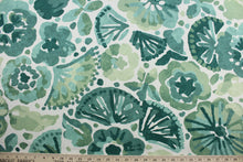 Load image into Gallery viewer, This multi-purpose fabric showcases a large floral print in shades of green against a white background. It features a soil and stain repellant finish and is rated at 100,000 double rubs for durability and abrasion resistance.  It can be used for several different statement projects including window accents (drapery, curtains and swags), toss pillows, headboards, bed skirts, duvet covers, upholstery, and more.
