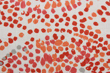Load image into Gallery viewer,  Robert Allen© Glimpse in Orange is a multi-purpose fabric perfect for any home decorating project.  Crafted from a cotton blend, it features a large circular print incorporating shades of orange, coral, gray, and off white. The fabric is also soil and stain resistant for easy care.  It can be used for several different statement projects including window accents (drapery, curtains and swags), toss pillows, headboards, bed skirts, duvet covers and upholstery. 

