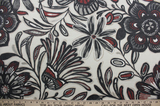 The large-scale floral print features shades of black, gray, henna, and cream on an off-white background. The durable fabric has a 30,000 double rub rating and is soil and stain resistant, making it a practical and fashionable choice.  It can be used for several different statement projects including window accents (drapery, curtains and swags), toss pillows, headboards, bed skirts, duvet covers, upholstery, and more.