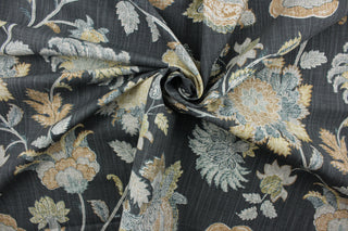 Charlotte is a multi-use fabric featuring a large floral print.  This fabric includes shades of gray, tan, blue, ivory, and a graphite background, providing a unique and sophisticated design.  It can be used for several different statement projects including window accents (drapery, curtains and swags), decorative pillows, hand bags, bed skirts, duvet covers, upholstery and craft projects.  