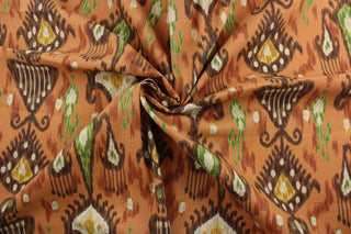 The Robert Allen© Kathandi in Cinnabar is the perfect outdoor fabric for whatever your needs. It's ikat print combines bright green, brown, cinnabar, dark yellow, and beige to add color and texture to any space. This fabric is U/V fade and water/stain resistant.  Perfect for porches, patios and pool side.  Uses include toss pillows, cushions, upholstery, tote bags and more. 