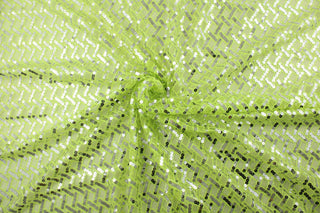  Enhance your style with Sequined Sparkle in Lime.  Silver sequins add a touch of glamour, while the lime green tulle base brings a pop of color.  Perfect for adding sparkle to special occasion apparel, dancewear, costumes, overlays, table tops, and decorations. 