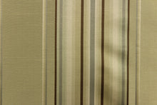 Load image into Gallery viewer, This stunning yarn dyed fabric features a multi width striped pattern brown, gray, and khaki with undertones of green.

