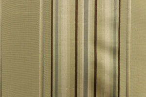 This stunning yarn dyed fabric features a multi width striped pattern brown, gray, and khaki with undertones of green.