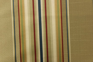 This stunning yarn dyed fabric features a multi width striped pattern in blue, red, gold, green and shades of khaki
