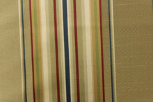 Load image into Gallery viewer, This stunning yarn dyed fabric features a multi width striped pattern in blue, red, gold, green and shades of khaki

