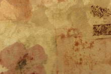 Load image into Gallery viewer, This jacquard offers a varying pattern of a flower mixed with lettering and a medallion in gold tones with muted gray, rose and brown colors. 

