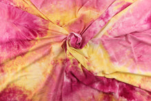 Load image into Gallery viewer, This lycra features a 8 way stretch in a fun tie dye design, with colors of  yellow and shades of pink with hints of orange. 
