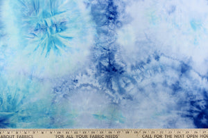This lycra features an 8 stretch in a fun tie dye design, with colors of shades of blue, aqua blue and hints of white. 