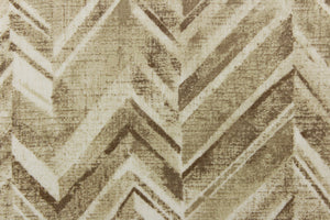  This fabric features a chevron design in shades of brown and white.
