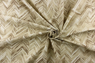  This fabric features a chevron design in shades of brown and white.