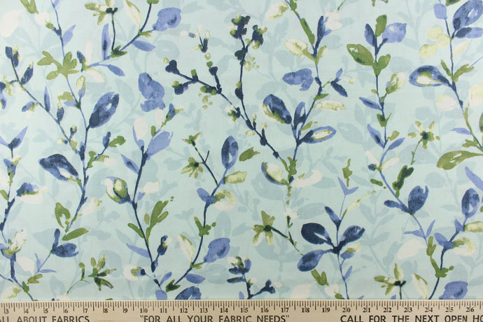 This beautiful fabric features a floral design in shades of blue, white, and green against a pale blue background. 