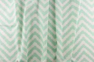 This fun design feature a wavy edge chevron pattern in mint green on a white background