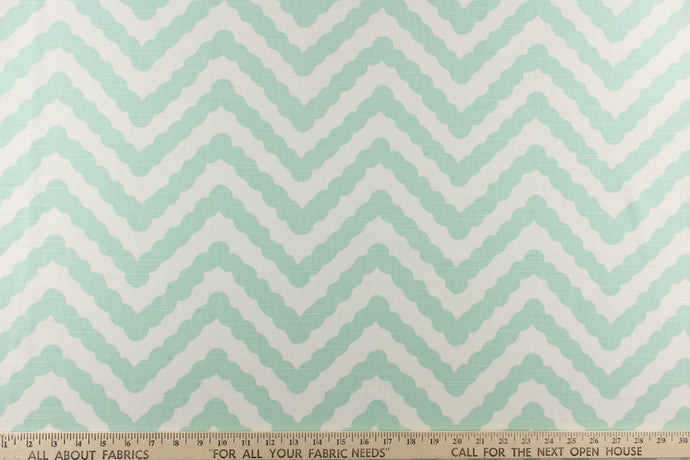 This fun design feature a wavy edge chevron pattern in mint green on a white background