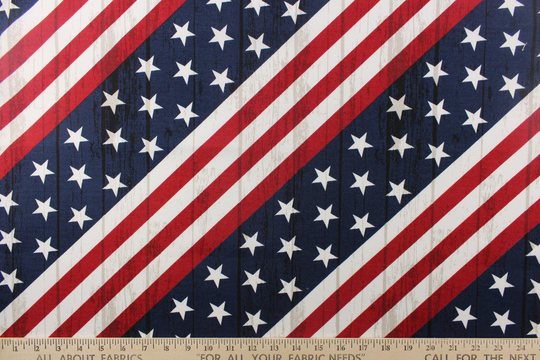 This fabric features an American flag in a diagonal direction with a wood grain look. 
