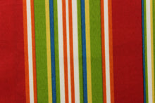 Load image into Gallery viewer, This fabric features a striped design in red, green, white, blue, orange and yellow.
