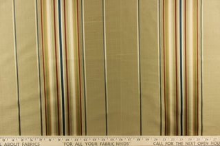 This stunning yarn dyed fabric features a multi width striped pattern in blue, red, gold, green and shades of khaki.