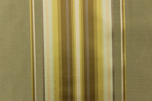 This stunning yarn dyed fabric features a multi width striped pattern in colors of gold, light gray, peach and khaki or beige. 