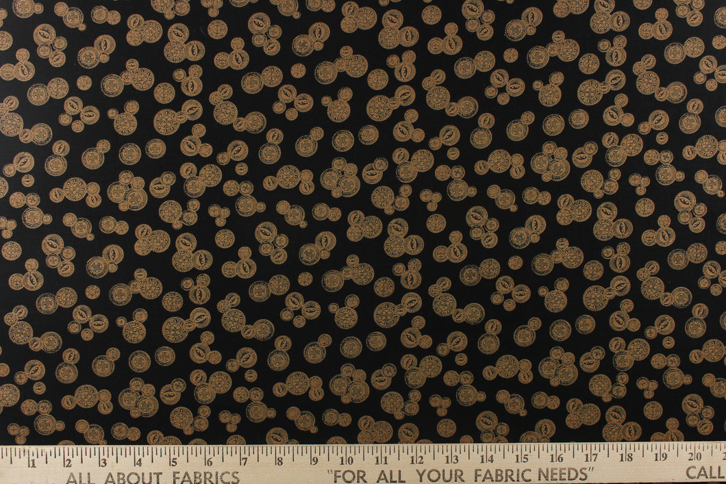  This elegant quilting print features vintage buttons in a copper or khaki color in different sizes set against a black background. 