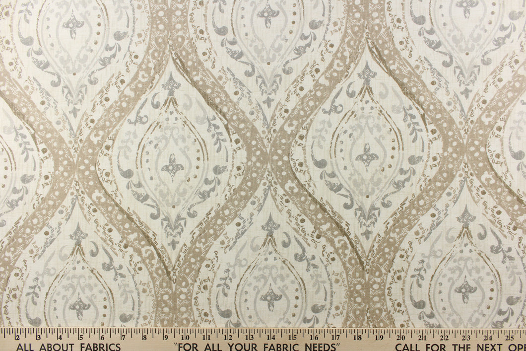 A large medallion design in dark taupe, bark brown, gray, light gray, and white.