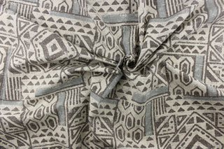  A Aztec geometric design in gray, dark gray against a off white background.
