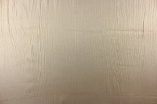 This fabric in gold with iridescent and a crinkle design.