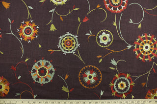 Suzani features an embroidered ethnic design in the autumnal colors of orange, red, green and cinnamon.  Uses include drapery, pillows, light upholstery, table runners, bedding, headboards, and home décor.