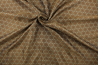 Hubble is a jacquard fabric that features circles in varying shades of brown and gold.