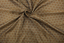 Load image into Gallery viewer, Hubble is a jacquard fabric that features circles in varying shades of brown and gold.
