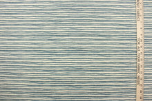 Load image into Gallery viewer,  This fabric features brushstroke stripes design in blue against pale beige .
