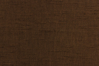 Voltaire is a woven, textured fabric in brown.