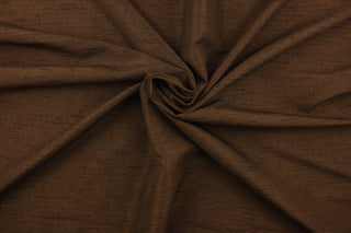 Voltaire is a woven, textured fabric in brown.