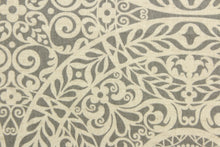Load image into Gallery viewer, This fabric features medallion design in gray and a dull white. 
