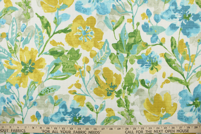 This multi use indoor/outdoor fabric features a large floral design in golden yellow, green, grey and shades of blue on a white background.  It is family friendly and perfect for outdoor settings or indoors in a sunny room.  It is stain and water resistant and can withstand up to 500 hours of direct sun exposure.  Uses include decorative pillows, cushions, chair pads, tote bags and upholstery.  