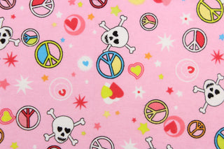A fun funky design of peace signs, skull, crossbones and hearts in blue, red, yellow, black, white, lime green and orange set against a pink background. 