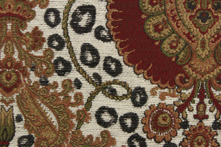 This tapestry features a beautiful medallion design in deep red, green, black, golden tan, and cream . 