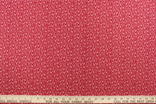 Load image into Gallery viewer, This fabric features a tiny floral vine design in white set against a red background. 
