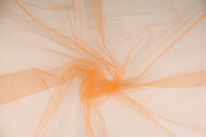  A sheer, semi firm, netting tulle in a true orange . 