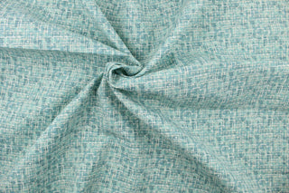 This medium weight fabric in sea green and white is stain and water resistant and can withstand up to 500 hours of direct sun exposure and has a durability rating of 30,000 double rubs.   Uses include decorative pillows, cushions, chair pads, tote bags, slip covers and upholstery.