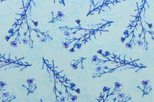 Load image into Gallery viewer,  A floral branch design  in blue with hints of dark pink, green, and white set against a pale blue.

