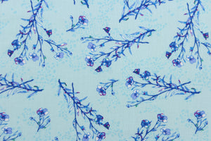  A floral branch design  in blue with hints of dark pink, green, and white set against a pale blue.
