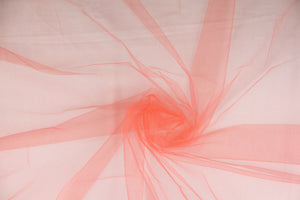 A sheer, semi firm, netting tulle in bright orange.