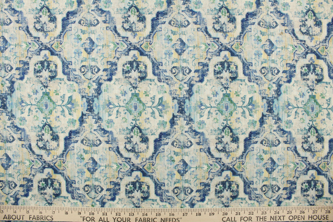  Stanbury Cliffside is a printed linen blend fabric featuring a distressed medallion design in shades of blue, green, light yellow and off white.  This multi use fabric is perfect for light duty upholstery projects, window treatments (draperies, swags, valances) and toss pillows.