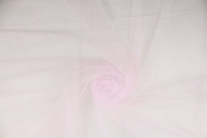 A sheer, semi firm, netting tulle in a light pink 