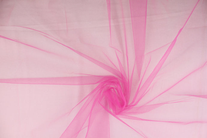 A sheer, semi firm, netting tulle in hot pink .
