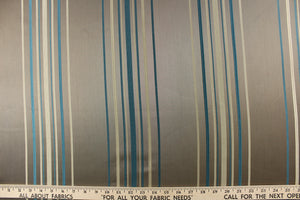 Teal blue and cream stripes on a darker taupe background