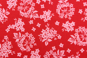  A floral design in red and light pink .