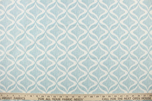 This printed fabric features a geometric design in white against thin vertical  aqua lines.  Perfect for window treatments, decorative pillows, handbags, light duty upholstery applications and almost any craft project.  This fabric has a soft workable feel yet is stable and durable.